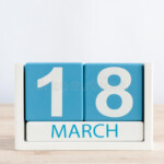 March 18th Day 18 Of Month Daily Calendar On Wooden Table Background